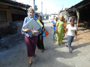 Walking the narrow back streets to the new agent's homes carrying the computers to be installed.